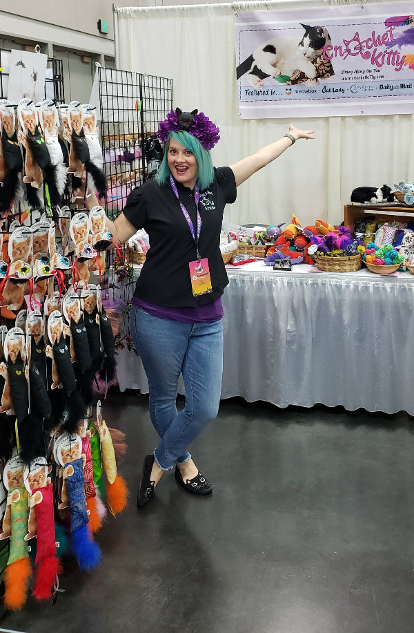 Abbie the owner with Crochet Kitty's products at a show.