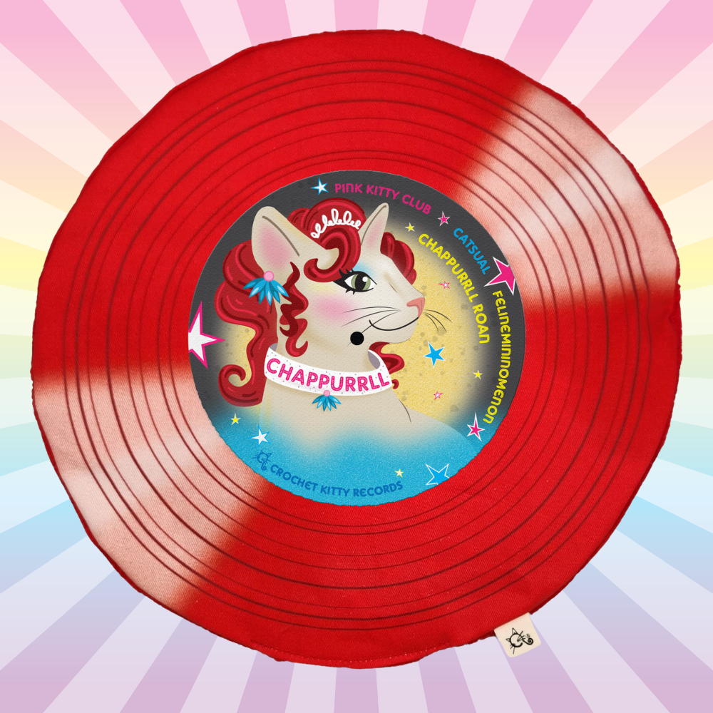 Red Chappurrll Roan catnip record mat with a curly-haired cat illustration on a pastel rainbow sunburst background.