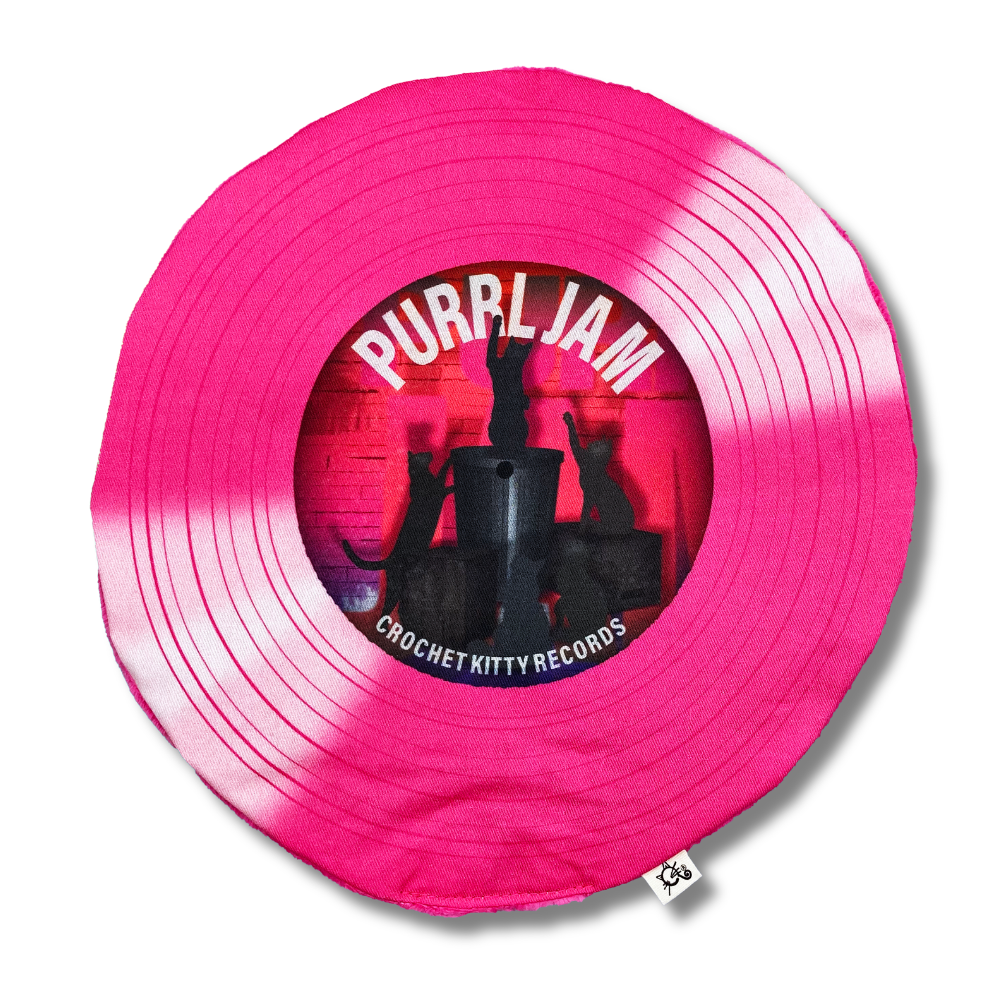 Purrl Jam record-shaped catnip cat toy with hot pink printed grooves and a center label featuring black cat silhouettes.