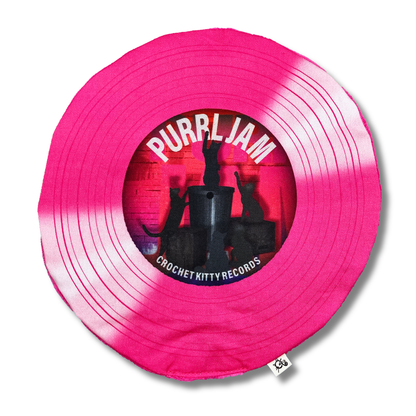 Purrl Jam record-shaped catnip cat toy with hot pink printed grooves and a center label featuring black cat silhouettes.