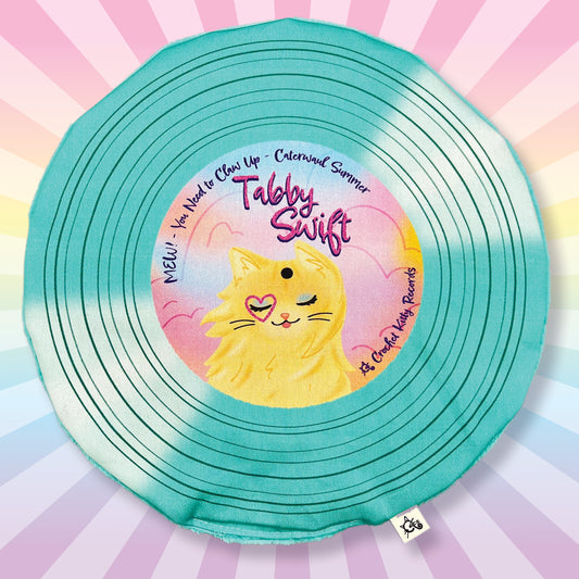 Tabby Swift teal record with rainbow rays be hide it showing off the record cat mat.